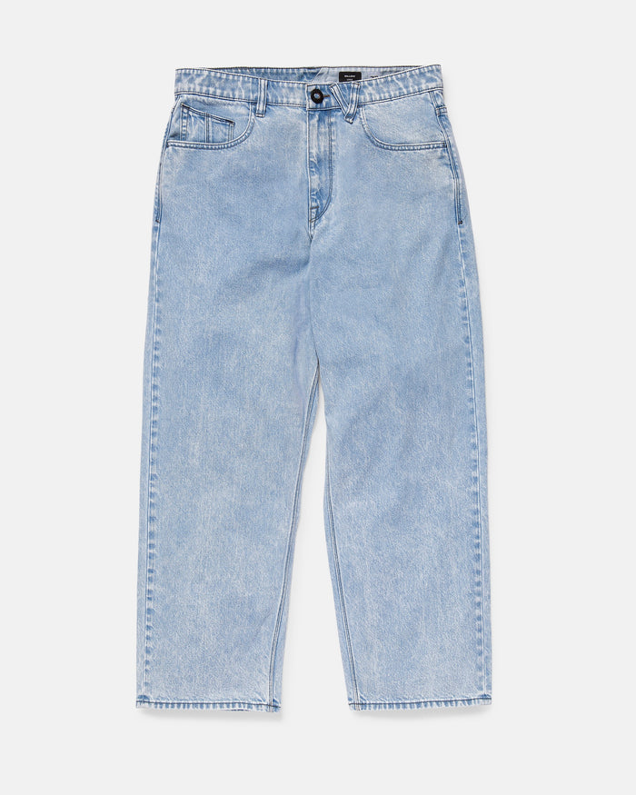 A pair of Volcom Men's Billow Denim Pants in light blue, high-waisted with a straight leg cut, made from recycled cotton. Features include a front button and zip closure and five pockets, shown laid flat on a white background.