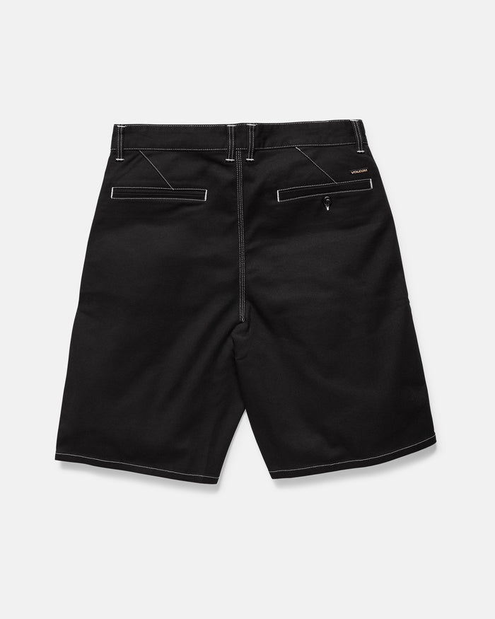 Volcom Men's Billow Shorts in black twill shown from the back, featuring white contrast stitching, flap back pockets (one with zipper), belt loop waistband, and a 22-inch outseam.