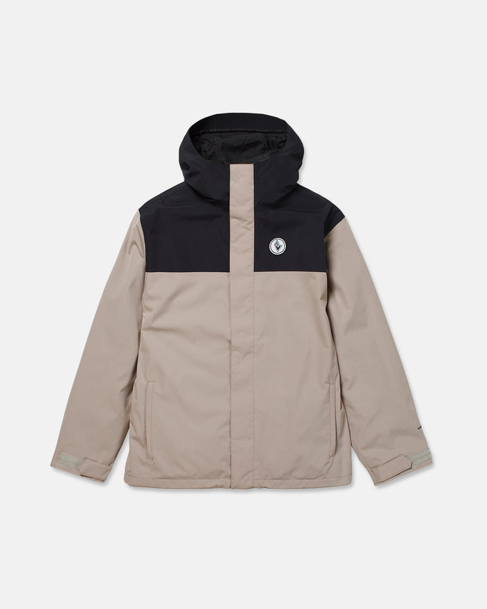 Introducing the Volcom Men’s Buckthreeeighty Insulated Jacket—a beige jacket made from recycled fabric, featuring a contrasting black hood and shoulder panel, front zipper, side pockets, long sleeves with adjustable cuffs, and a circular Volcom logo on the left chest.
