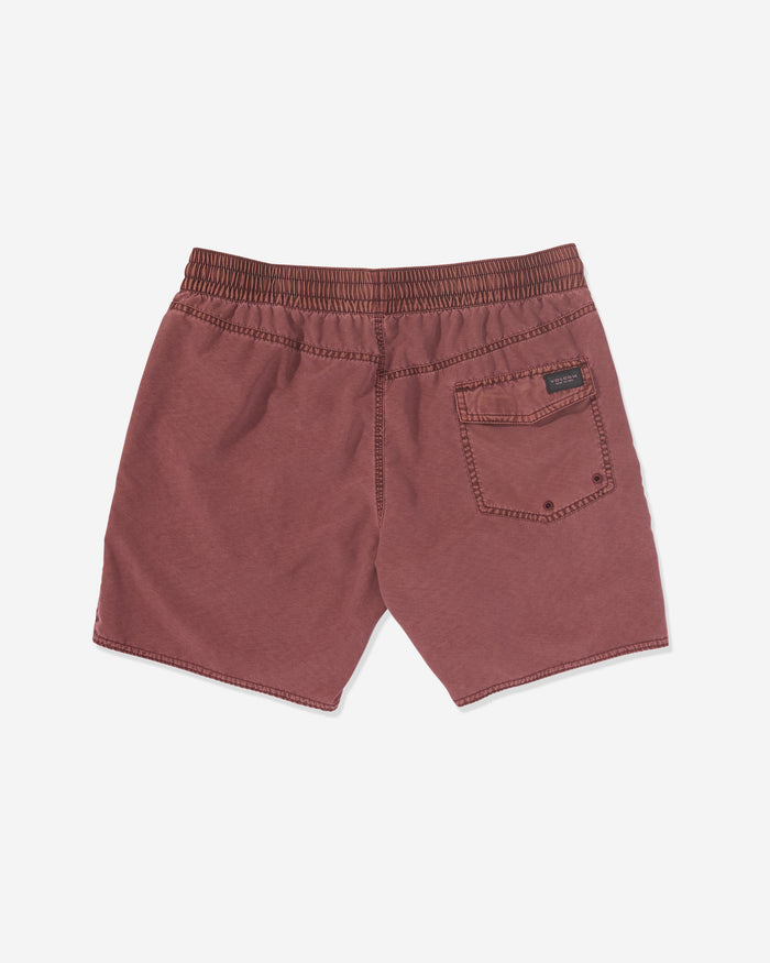 Back view of Volcom Men's Center Elastic Waist Trunks in maroon, featuring an elastic waist, right back pocket with a black label above it. Made from a polyester blend and shown laid flat on a white background.