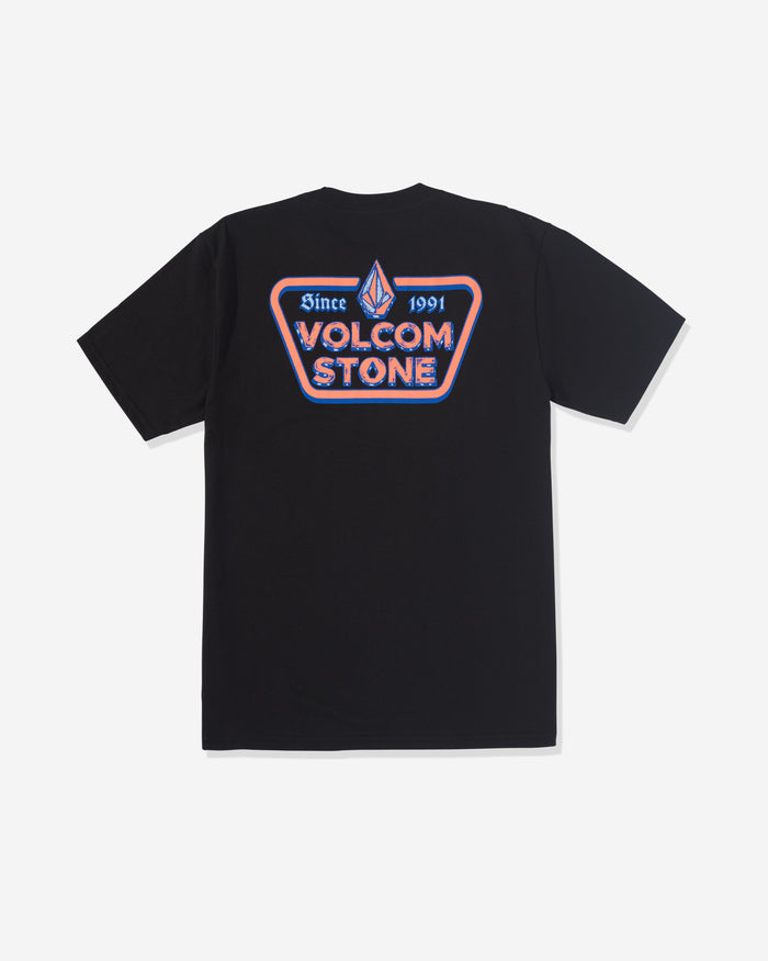 The Volcom Men's Countertop Short Sleeve Tee is a black 100% cotton T-shirt featuring a large back graphic with a red, white, and blue patch reading "Since 1991 VOLCOM STONE" and a stylized stone logo above.