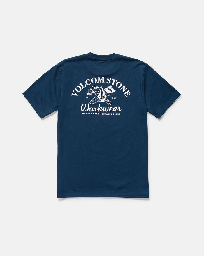 The Volcom Men's Crosscut Workwear Short Sleeve Tee in navy offers all-cotton comfort and features a back white graphic with “VOLCOM STONE Workwear,” crossed tools, and “Quality Made - Durable Goods” underneath.