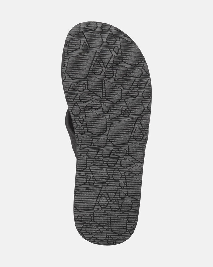 The image features the bottom sole of Volcom's Men's Daycation 2 Hawaii Sandals. The dark gray sole has a geometric, textured pattern for grip, set against a plain white background.