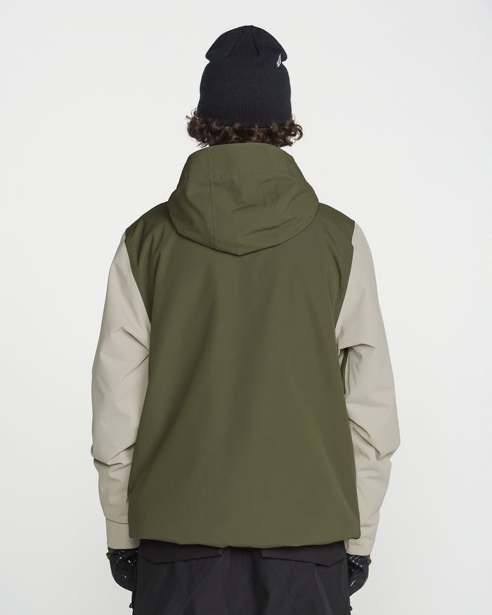 A person wearing the Volcom Men’s Double Insulated Jacket in green and beige, paired with black gloves and a black beanie, stands with their back to the camera against a plain white background.