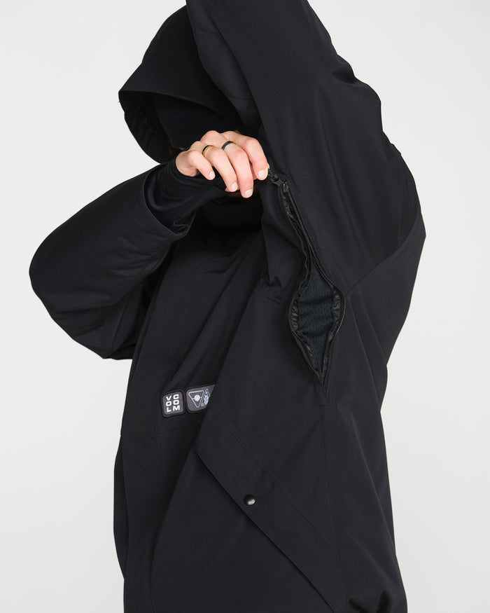 A person wearing the Volcom Men’s Double Insulated Jacket lifts their arm to display a zippered underarm vent with a mesh lining inside. Their face is mostly obscured.