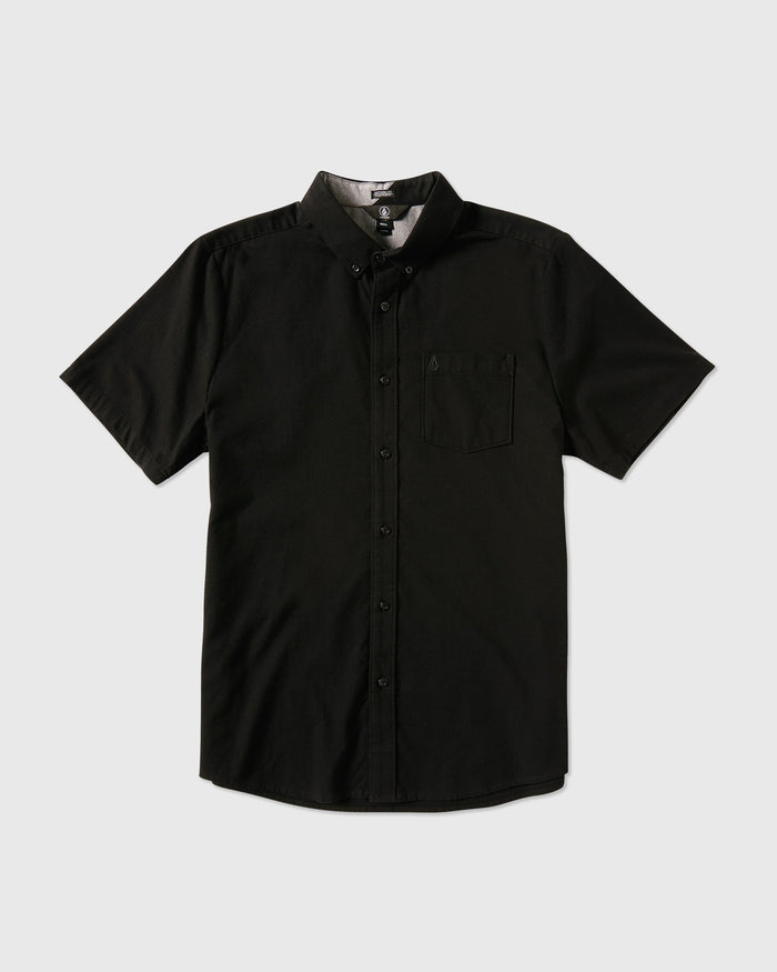 The Volcom Men's Everett Oxford Short Sleeve is a black, slim-fit shirt with a collar and single chest pocket, displayed flat on a white background.