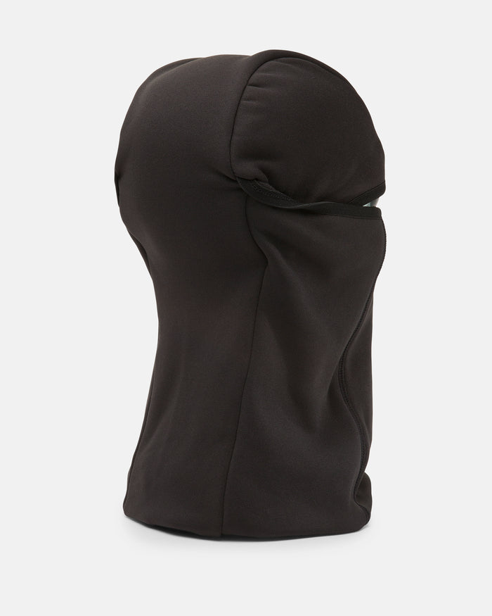 A black, form-fitting Volcom Men’s Face Pow balaclava mask is shown on a white background, viewed from the side and slightly behind, fully covering the head and neck with a sleek, streamlined design.