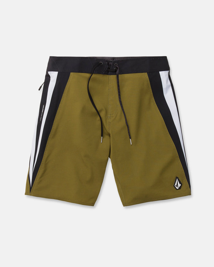 Men's Facet Mod board shorts by Volcom in olive green, featuring black and white side panels, a black waistband with matching drawstring, and a small logo patch on the lower left leg. Crafted from 4-way stretch Mod-Tech fabric for optimal comfort and flexibility, these Y2K-inspired shorts are shown laid flat on a white background.