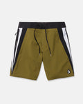 Men's Facet Mod board shorts by Volcom in olive green, featuring black and white side panels, a black waistband with matching drawstring, and a small logo patch on the lower left leg. Crafted from 4-way stretch Mod-Tech fabric for optimal comfort and flexibility, these Y2K-inspired shorts are shown laid flat on a white background.