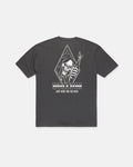 The Men's Fear No Beer Short Sleeve Tee by Volcom is a loose fit black graphic cotton shirt, featuring a white hooded skeleton holding a beer bottle. The design includes the phrases "DEATHWISH," "JUST HERE FOR THE BEER," and "Fear No Beer.
