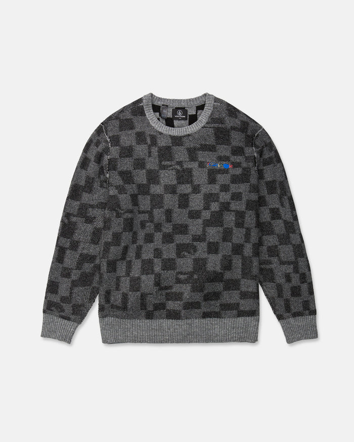 The Volcom Men's Featured Artist Antonio Carrau Sweater is a gray jacquard sweater with a black checkered pattern, ribbed cuffs and hem, and a small multicolored logo on the left chest. This sweater features a boxy fit and is shown laid flat on a white background.