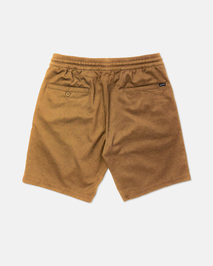 Volcom Men's Frickin Elastic Waist Shorts in brown, made with REPREVE recycled fibers, feature two back pockets—one with a button closure—and a small black label above the right pocket. Displayed on a plain white background.