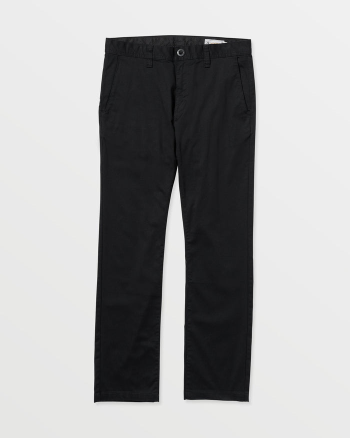 Men's Frickin Modern Stretch Pants by Volcom in black, featuring button and zip closure, front pockets, belt loops, and made with REPREVE recycled fibers, displayed on a white background.