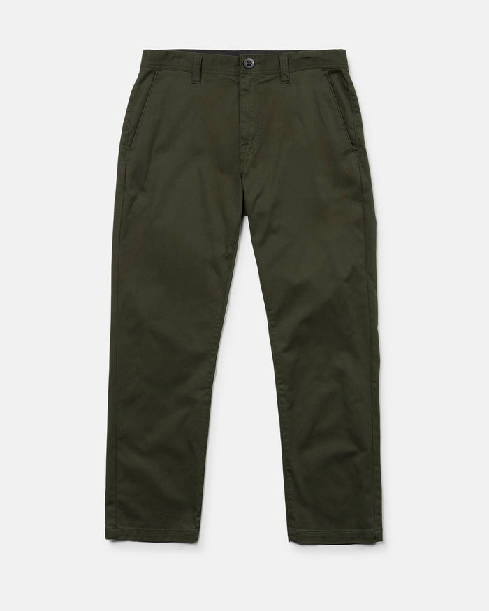 A pair of Volcom Men's Frickin Modern Stretch Pants in olive green, featuring a straight-leg cut with side pockets, front button closure, and zip fly. Crafted from REPREVE recycled fibers for sustainability, these modern stretch chino pants are displayed flat against a white background.