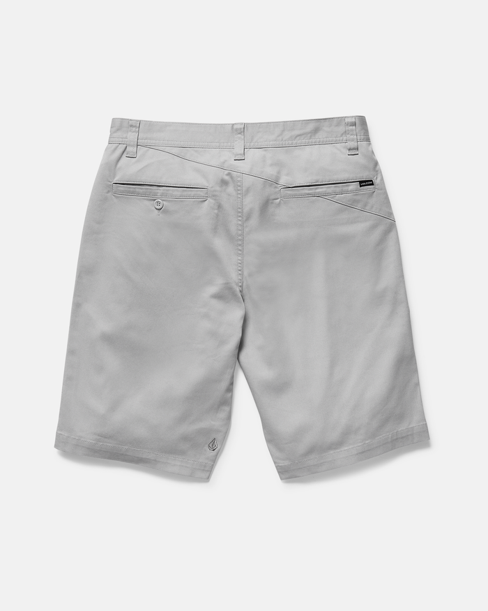 Back view of Volcom Men's Frickin Modern Stretch Shorts in light gray shows belt loops, two back pockets—one buttoned, one with a black tag—visible seams, and a logo on the left hem. Breathable cotton-poly fabric offers everyday comfort.