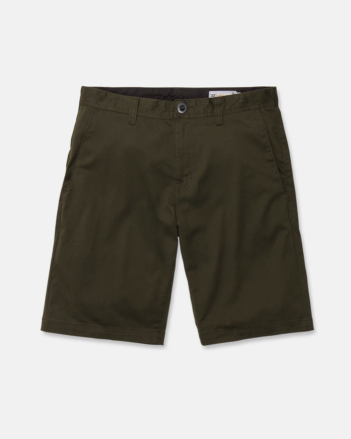 A pair of Volcom Men's Frickin Modern Stretch Shorts in dark green, featuring a knee-length cut, side pockets, belt loops, and a button closure, made from breathable cotton-poly stretch fabric and shown on a white background.