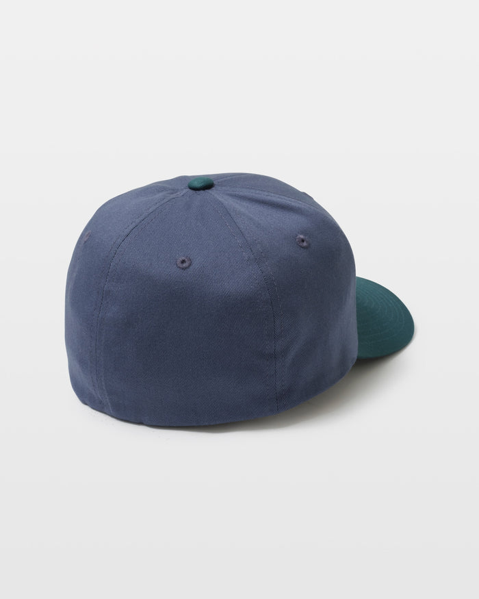 The Men's Full Stone Flexfit Hat by Volcom, featuring a blue crown with a green brim and top button, is displayed from the back against a plain white background.