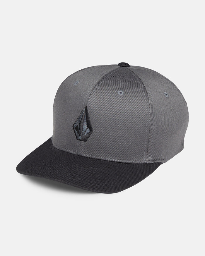 The Volcom Men's Full Stone Flexfit Hat features a gray structured stretch twill design, black brim, and an embroidered black geometric logo on the front, shown against a plain white background.