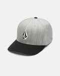 The Volcom Men's Full Stone Heather Flexfit Hat, shown against a white background, features a gray structured stretch twill design with a black brim and is finished with a black-and-white geometric Volcom logo on the front.