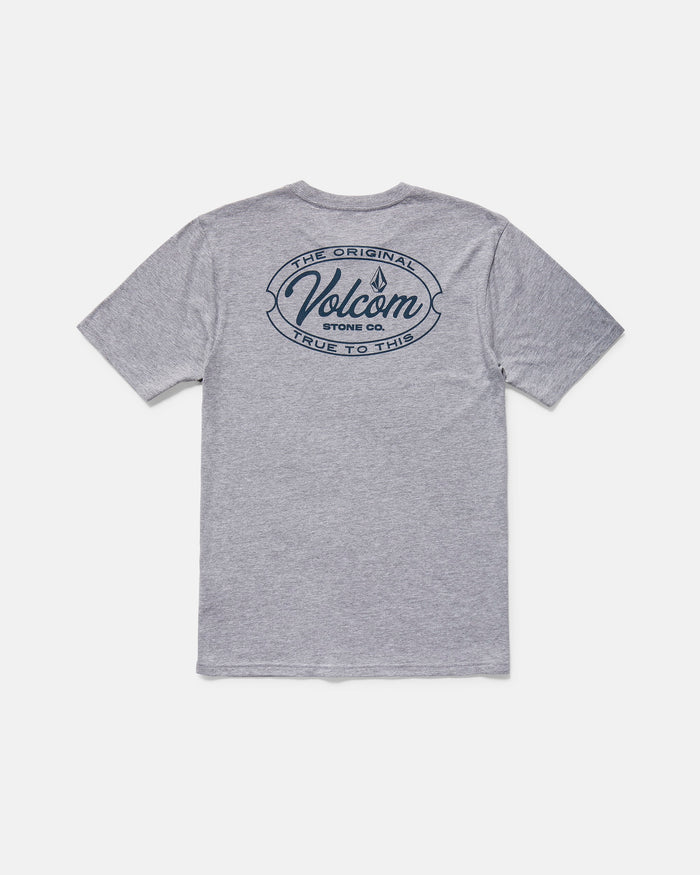 The Volcom Men's Garaged Short Sleeve Tee features a modern fit, heather gray fabric, a bold navy Volcom Stone Co. logo, and "The Original, True to This" text printed on the upper back.