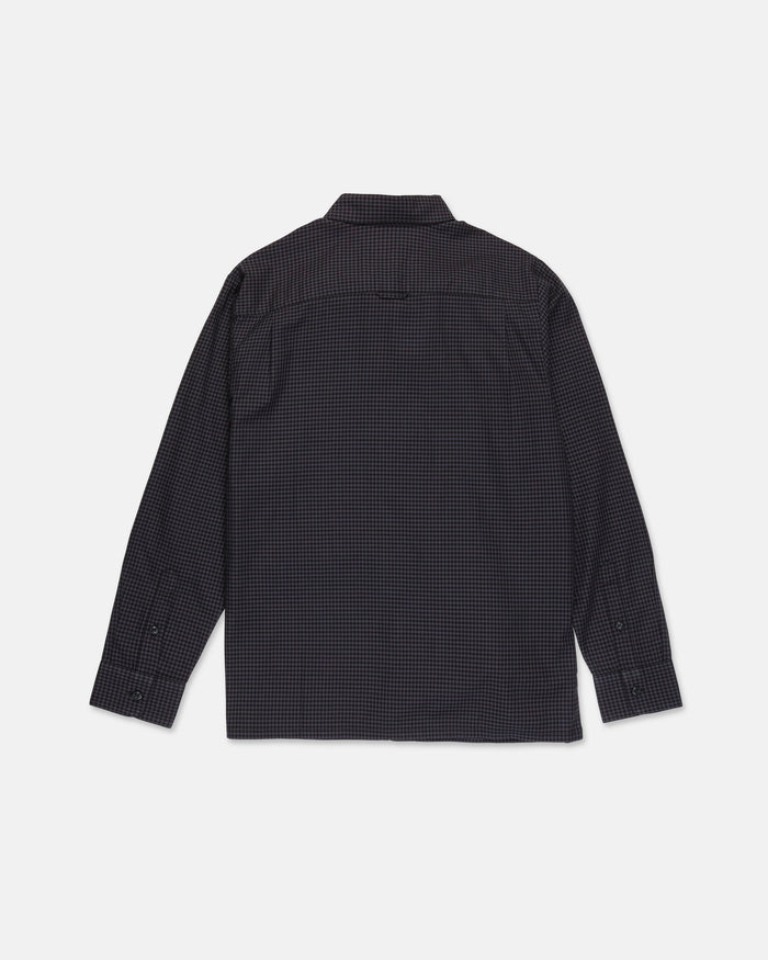 The Volcom Men's Glasnow Long Sleeve Shirt features a dark, small checkered pattern and subtle yarn-dyed dobby texture, displayed from the back on a plain white background.
