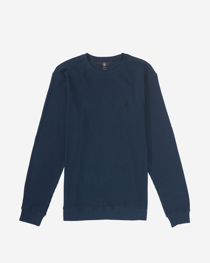 The Volcom Men's Gridstone Crew Long Sleeve in navy blue features a subtle textured pattern and is shown laid flat on a white background.