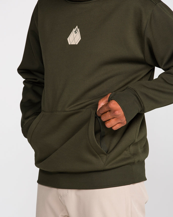 A person wearing the Volcom Men’s Hydro Riding Hoodie in olive green, featuring a geometric design on the chest and paired with light beige pants, places their hand in the front pocket of the hoodie. The hydrophobic fleece material offers comfort and durability for everyday wear.