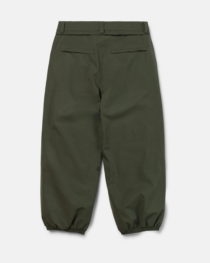 The Volcom Men’s Lapper Pants, shown here in olive green from the back, feature two zipped rear pockets, belt loops, and elasticized cuffs at the ankles. Crafted from thick, durable material with a relaxed fit reminiscent of classic baggy men’s ski pants, they’re an ideal choice for outdoor adventures.