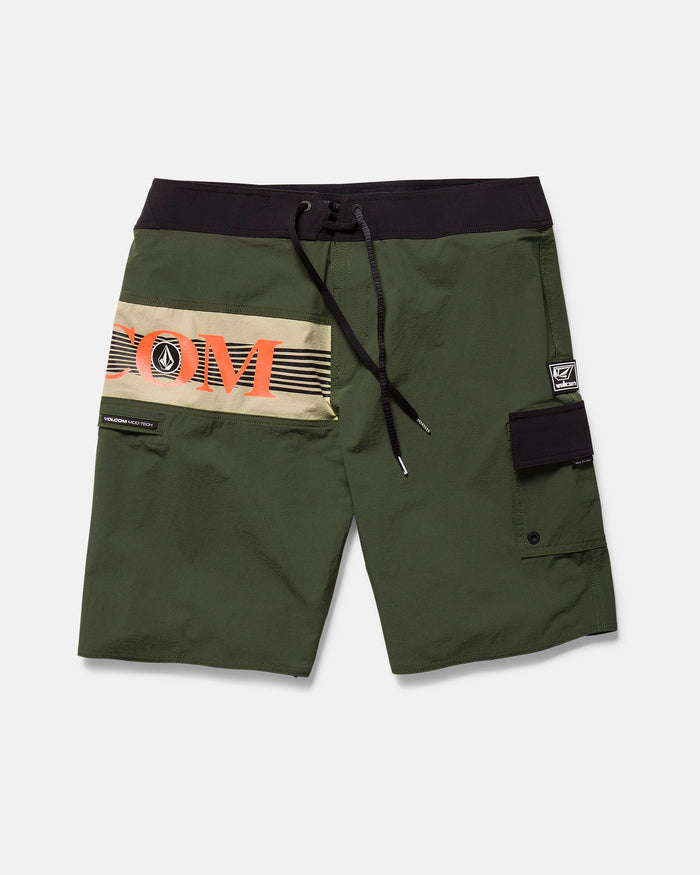 The Men's Liberator Mod board shorts by Volcom feature an olive green body, black waistband and drawstring, Cinch Fly Technology, tan and orange horizontal V O L C O M design, a right-leg Velcro pocket with logo patch.
