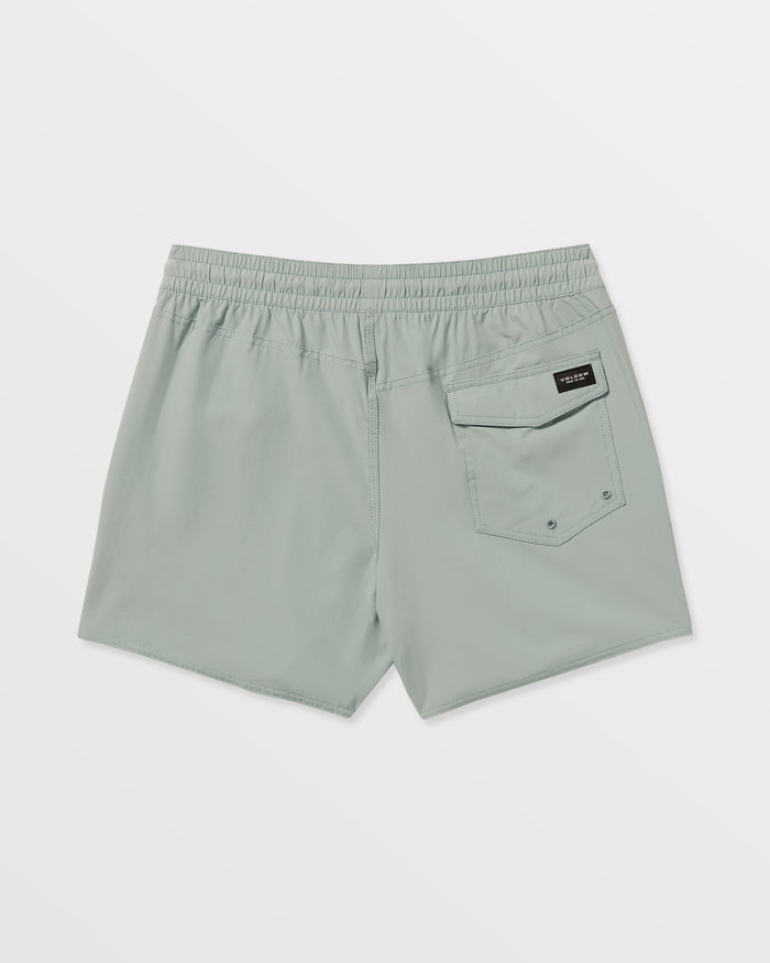 The Volcom Men's Lido Solid 16" Trunks in light gray feature an elastic waistband, single back pocket with a black rectangular label, two small grommets at the bottom, and are made from recycled polyester. Displayed on a plain white background.