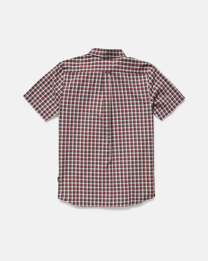 Back view of the Volcom Men's Louie Check Short Sleeve Tee, showcasing a red, white, and black plaid pattern with a light blue acid check effect against a plain light gray background.