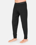 A person wearing Volcom Men’s M Merino Blend Pants in black stands barefoot on a white background, highlighting the pants’ quick-dry performance.