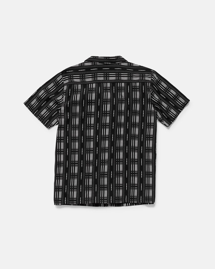 The Volcom Men's Macros Short Sleeve Tee is displayed flat with the back facing up. It features a boxy fit, black base, and white geometric grid pattern.