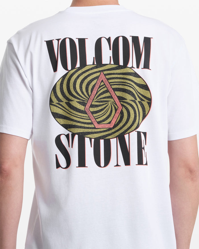 A person wears the Volcom Men's Mindsign Short Sleeve Tee, an all-cotton shirt with VOLCOM STONE in bold black letters and a swirling green and black oval on the back with a red diamond logo—ideal for everyday style.