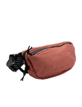 A dusty rose Volcom Men’s Mini Dos Waist Pack featuring a zippered main compartment and an adjustable black strap, shown against a plain white background.