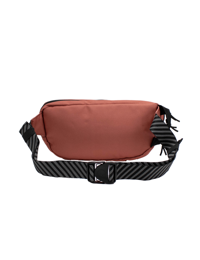 The Volcom Men's Mini Dos Waist Pack, featuring a reddish-brown design with a black zipper and an adjustable black strap adorned with diagonal gray stripes, is displayed on a plain white background.