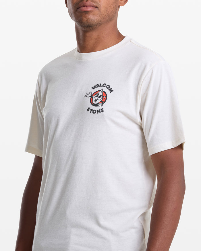 A person wears the Volcom Men's Mister Stone Short Sleeve Tee, a white T-shirt with a small "Volcom Stone" graphic on the left chest. The background is white and the person's face is partially out of frame.