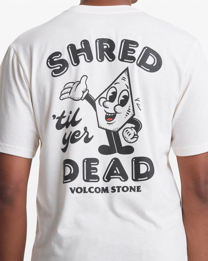 A person wears the Volcom Men's Mister Stone Short Sleeve Tee, featuring a cartoon stone character and “SHRED til yer DEAD” with bold “VOLCOM STONE” lettering on the back.