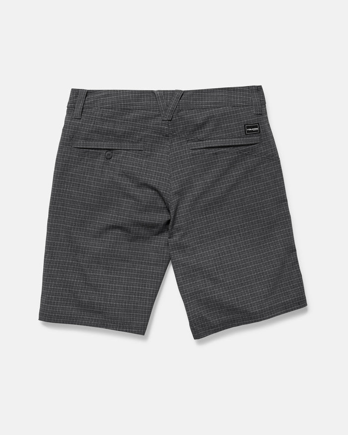 The Volcom Men's Mix Frickin Cross Shred Shorts in gray plaid feature a fixed waist, two rear pockets—one with a recycled buckle button, one with a black logo tag—belt loops, and a subtle checkered pattern.