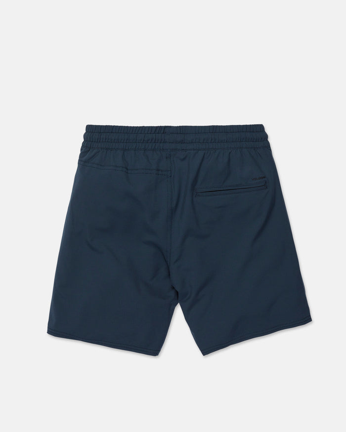 The Men's Nomoly Elastic Waist Shorts by Volcom are shown from the back in navy blue, featuring an elastic waistband and a single zippered pocket on the right side. Crafted with comfortable 4-way stretch fabric, these athletic shorts are displayed against a plain white background.