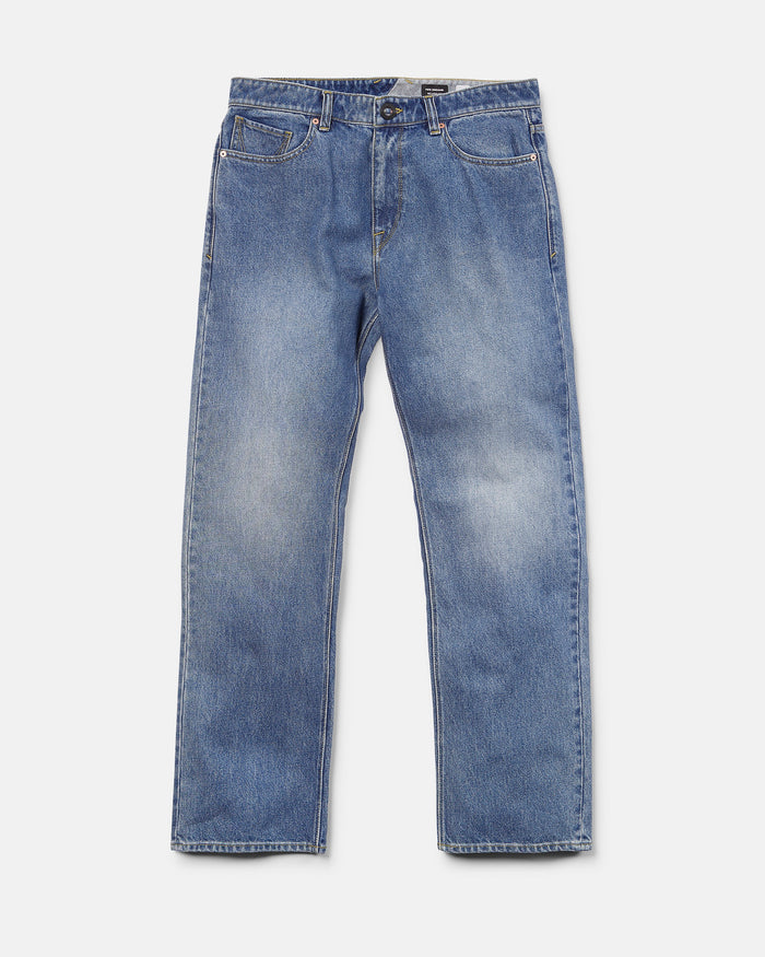 Men’s Pipe Dreams Denim Pants by Volcom, shown on a white background, feature a vintage-inspired denim look in classic blue with a relaxed straight fit, front and back pockets, and a button and zipper closure.