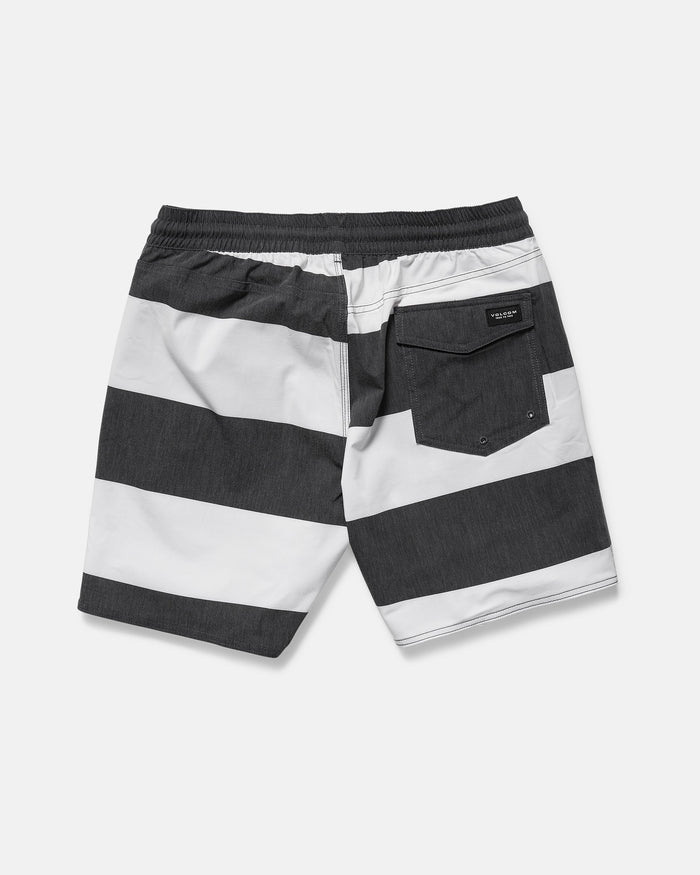 Back view of Volcom Men's Psyche Cotton 17" Trunk in black and white horizontal stripes, featuring a 17-inch outseam, elastic waistband, and a single flap back pocket on the right.