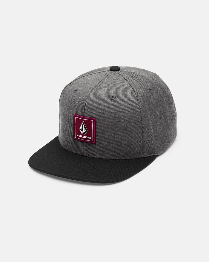 The Men's Quarter Evo Twill by Volcom is a gray cotton twill snapback hat featuring a black brim and a maroon square Volcom logo patch on the front panel, displayed against a plain white background.