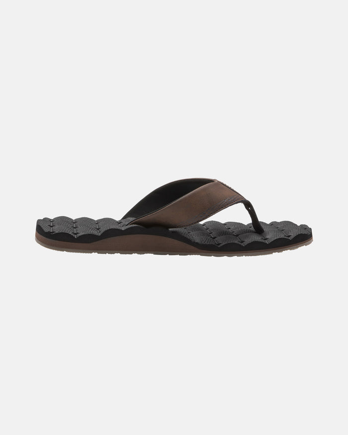 A single Volcom Men's Recliner flip-flop with a black textured sole and dark brown/black strap, shown side profile on a white background, offers extra cushy comfort.