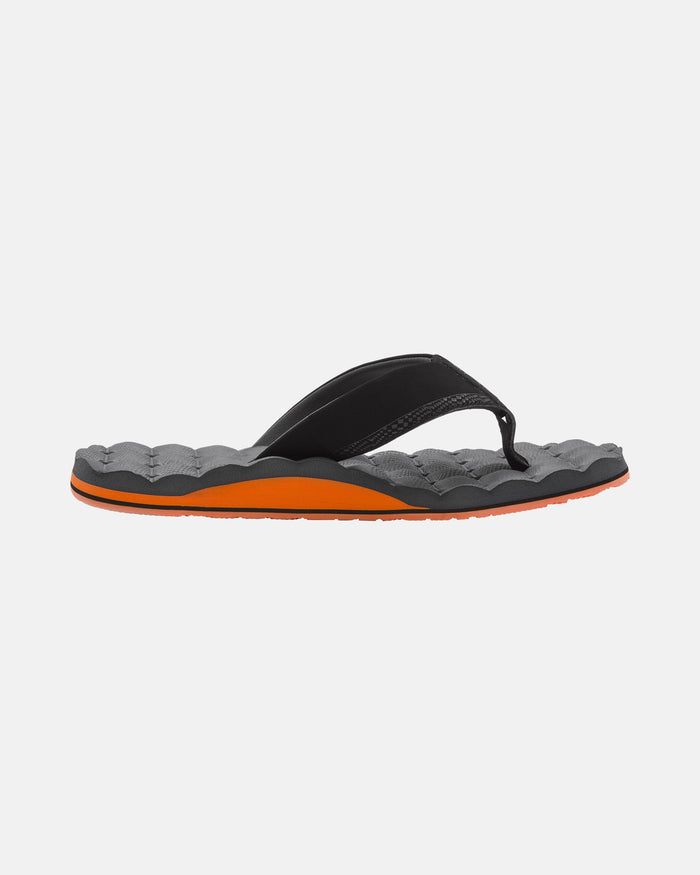 A single Volcom Men's Recliner flip-flop with a black strap, gray textured footbed, and orange sole is shown on a white background, providing cushy comfort.