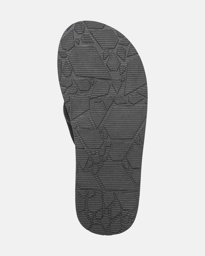 A close-up of the sole of the gray Volcom Men’s Recliner sandal shows its geometric textured pattern on the bottom, designed for extra grip.