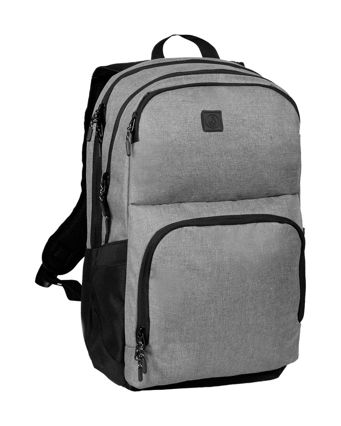 A Men's Roamer 3 Backpack by Volcom in gray and black, featuring multiple zippered compartments, a top handle, ergonomic mesh straps, and a padded laptop zone, displayed against a white background.