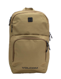 Men's Roamer 3 Backpack by Volcom in tan, featuring multiple zippered compartments, black zippers, and a small black logo patch on the upper front. This spacious 22L backpack includes a padded laptop sleeve for added convenience, with the word VOLCOM printed in black at the bottom front.