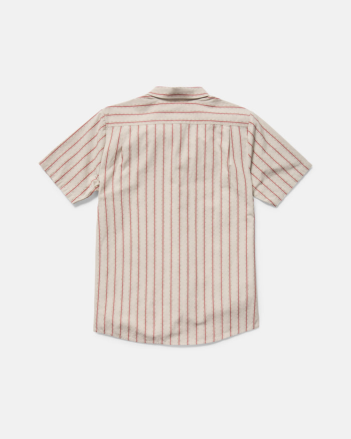 The Volcom Men's Sato Stripe Short Sleeve Tee features a classic fit and yarn-dyed red stripes on a beige background, shown from the back against a white surface.