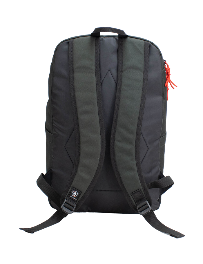 The Volcom Men's School Backpack is displayed from the back against a plain white background. It features ergonomic, padded shoulder straps, adjustable chest and waist straps, and a small Volcom logo near the bottom. A red zipper pull accents the right side. Inside, a padded laptop sleeve offers secure storage for your device.